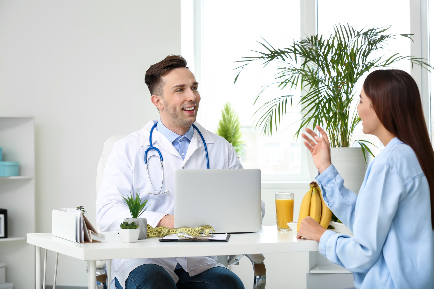 Young Woman Visiting Nutritionist in Weight Loss Clinic